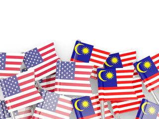 Wall Mural - Pins with flags of United States and malaysia isolated on white