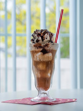 Root Beer Float On Tabletop With Choc Sauce