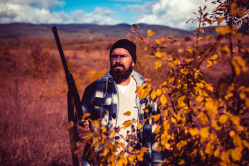 Wall Mural - Autumn hunting season. Hunter with shotgun gun on hunt. Autunm hunting. Hunting in America. Mountain hunting.