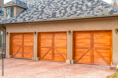 Luxurious Exterior Of A House With Stylish Brown Wooden Garage