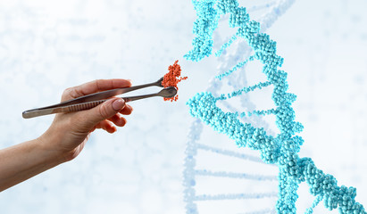 DNA molecules design with female hand holding pincers. Mixed media