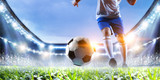 Fototapeta Fototapety sport - Soccer player on stadium in action. Mixed media