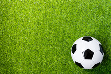 Top View Of Soccer Ball On Grass Feild Background With Copy Space