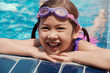 © SewcreamStudio - Healthy and happy Asian girl wearing goggles in swimming pool