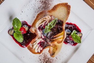 Wall Mural - Dessert with berries on white plate