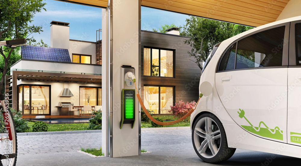 Charging an electric car in the garage near the house. Modern house with solar panels on the roof. - obrazy, fototapety, plakaty 