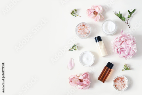 styled-beauty-composition-skin-cream-jar-tonicum-bottle-roses-peony-flower-and-himalayan-salt-on-white-table-background-organic-cosmetics-spa-concept-empty-space-flat-lay-top-view