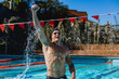 © Wavebreak Media - Male swimmer standing in swimming pool