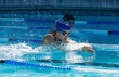 © Wavebreak Media - Female swimmers swimming freestyle in swimming pool