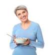 © Pixel-Shot - Mature woman with bowl of oatmeal on white background