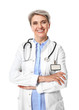 © Pixel-Shot - Mature female doctor on white background