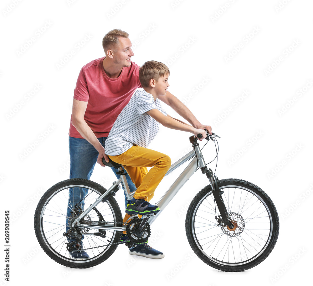 Father and his son with bicycle on white background