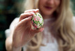 © asashka - Woman holding Easter egg close up