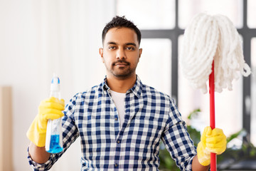 Sticker - cleaning, housework and housekeeping concept - indian man with mop and detergent at home