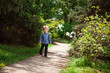 © justesfir - Cute little boy walking and smiling outdoors on nature in summer