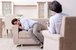 © Elnur - Young male patient discussing with psychologist personal problem