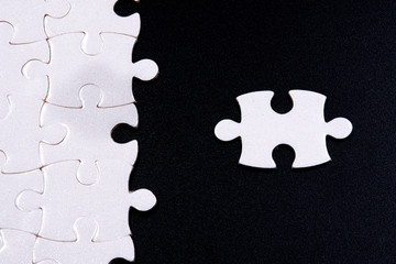 White jigsaw puzzle with black background