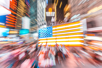 Wall Mural - American flag in New York at night, blurred image