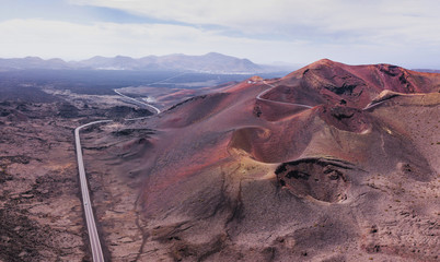 Nature panoramic landscape of volcano craters in Timanfaya national park in Lanzarote island, aerial view of Canary islans, Spain