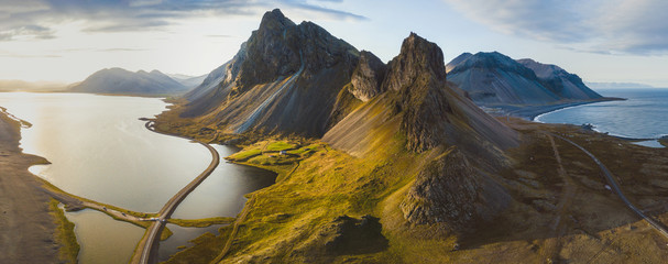 scenic road in iceland, beautiful nature landscape aerial panorama, mountains and coast at sunset