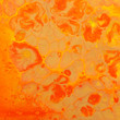 photography of abstract marbleized effect background. red and orange creative colors