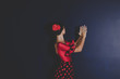 woman in red dress dancing spanish flamenco