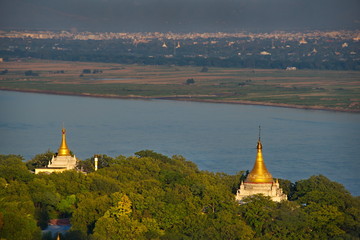 Wall Mural - Myanmar. View of Buddhist temples from a Soon U Ponya Shin pagoda located on top of a high hill in Sagain on the banks of the Irrawaddy river.