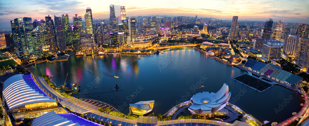 Aerial view of Singapore skyline and Marina Bay at sunset - obrazy, fototapety, plakaty 