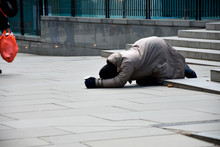 Unhappy Homeless Man Asking Help