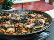 Close up image of paella with seafood and chicken.