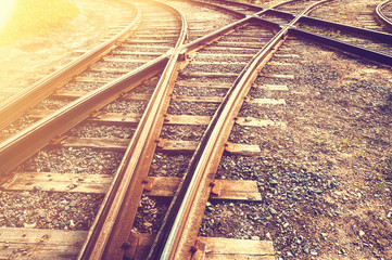 A railway track litted by the sun, toned.