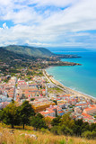 Fototapeta  - Beautiful seascape in Sicilian Cefalu, Italy photographed from adjacent hills overlooking the bay. The city on Tyrrhenian coast is a popular summer vacation destination