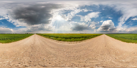 Wall Mural - full seamless spherical hdri panorama 360 degrees angle view on gravel road among fields in summer d