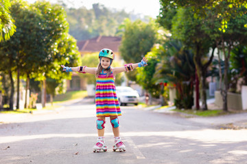 Wall Mural - Child on inline skates. Kids skate roller blades.