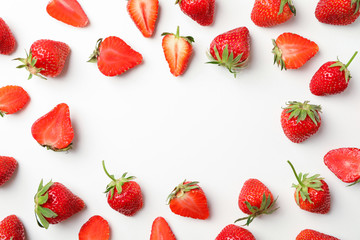 Wall Mural - Flat lay composition with strawberries on white background, space for text. Summer sweet fruits and berries