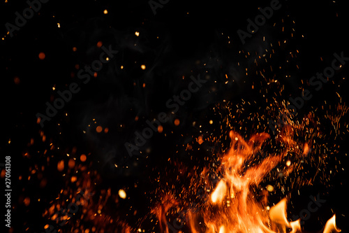 Cuadros en Lienzo Detail of fire sparks isolated on black background