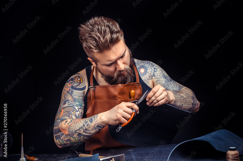 Leather Tanner Rack Leather Tanner cuts out leather goods Stock Photo | Adobe Stock