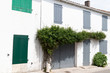 Saint Martin de Re village on Ile de Re, France with white house and green grey shutter