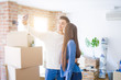 © Krakenimages.com - Young asian couple smiling taking a selfie photo with smartphone, moving to a new home together