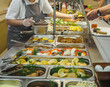 Cuisine cafeteria buffet with food. Self-service food display showcase
