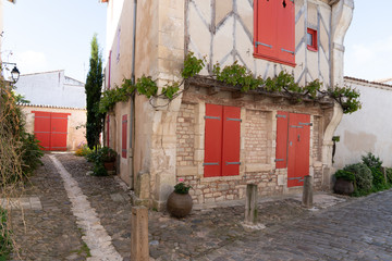 Wall Mural - Ile de Re old timbered red house building historical in France Saint Martin