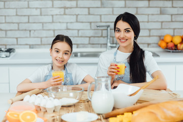 Focus at two pretty sisetrs have a cooking time in the kitchen!