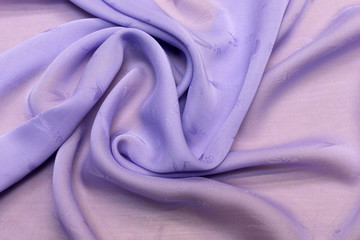 Texture, background. template. Chiffon silk fabric of light lilac color in artistic layout