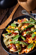 Pasta salad with green asparagus, olives and parma ham