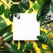 © jchizhe - Summer and spring concept. Tropical nature background with green leaves and white empty square frame for copy space on yellow paper. Top view. Flat lay. Creative advertising