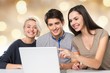 © BillionPhotos.com - Group of students with laptop and book doing  lessons