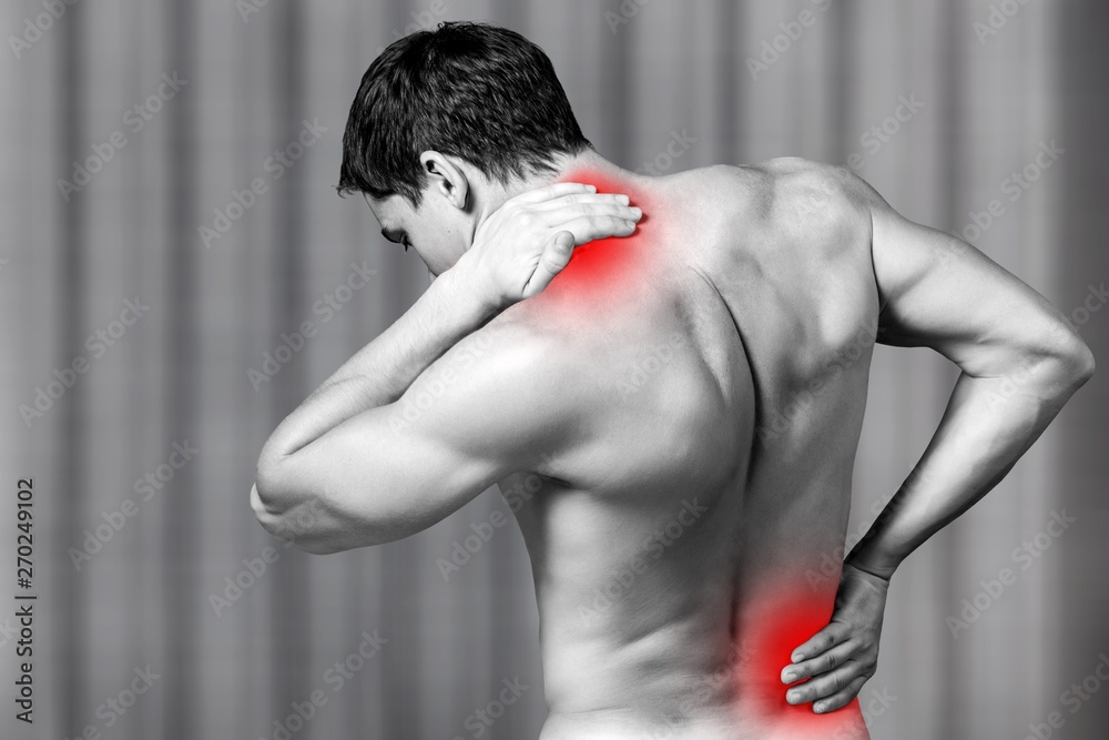 Back view of shirtless man touching his aching back and neck Stock ...
