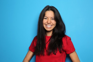 Attractive young woman posing on color background