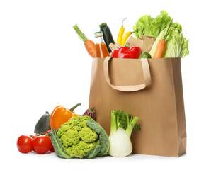 Sticker - Paper bag with fresh vegetables and bottle of juice on white background