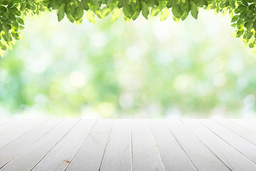 Wall Mural - Empty wooden table with party in garden background blurred.